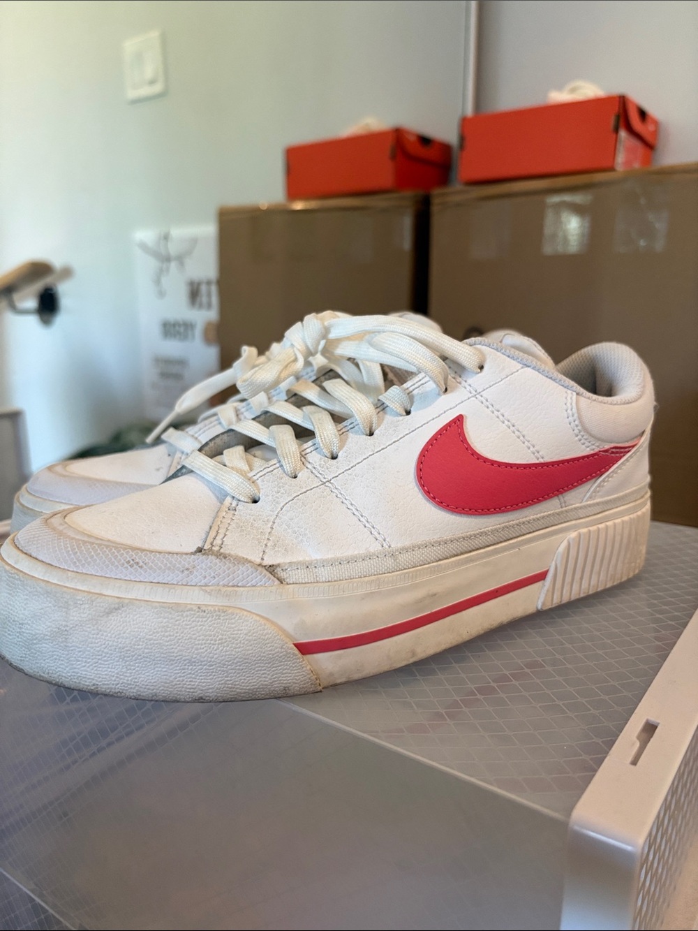Nike Men's White Sneakers with Pink Swoosh Accent